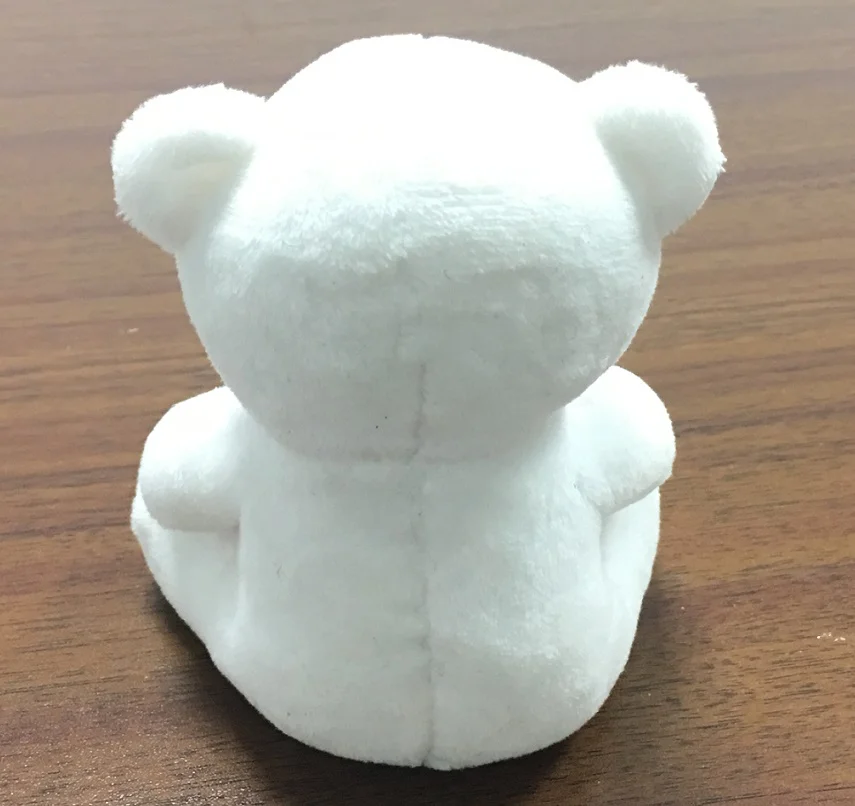 white teddy bear with heart