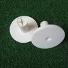 White rubber golf tee holders for driving range mats