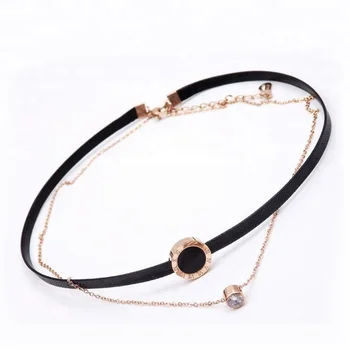 black choker with gold chain