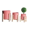 Cheap garden spring cylinder shaped glazed ceramic flower pot planter with wooden stand for sale