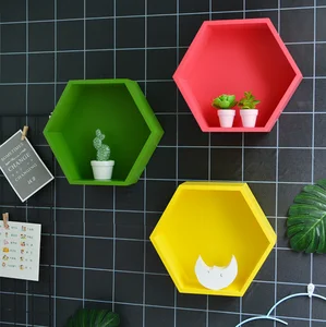 Image of Simple and creative solid wood hexagonal shelving wall decoration