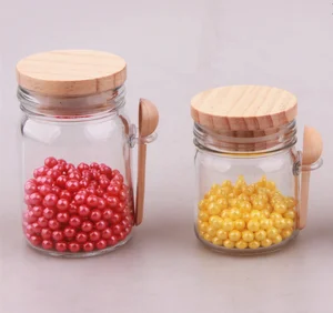Image of 150ml bulk glass candy jar with wooden lid and wooden spoon