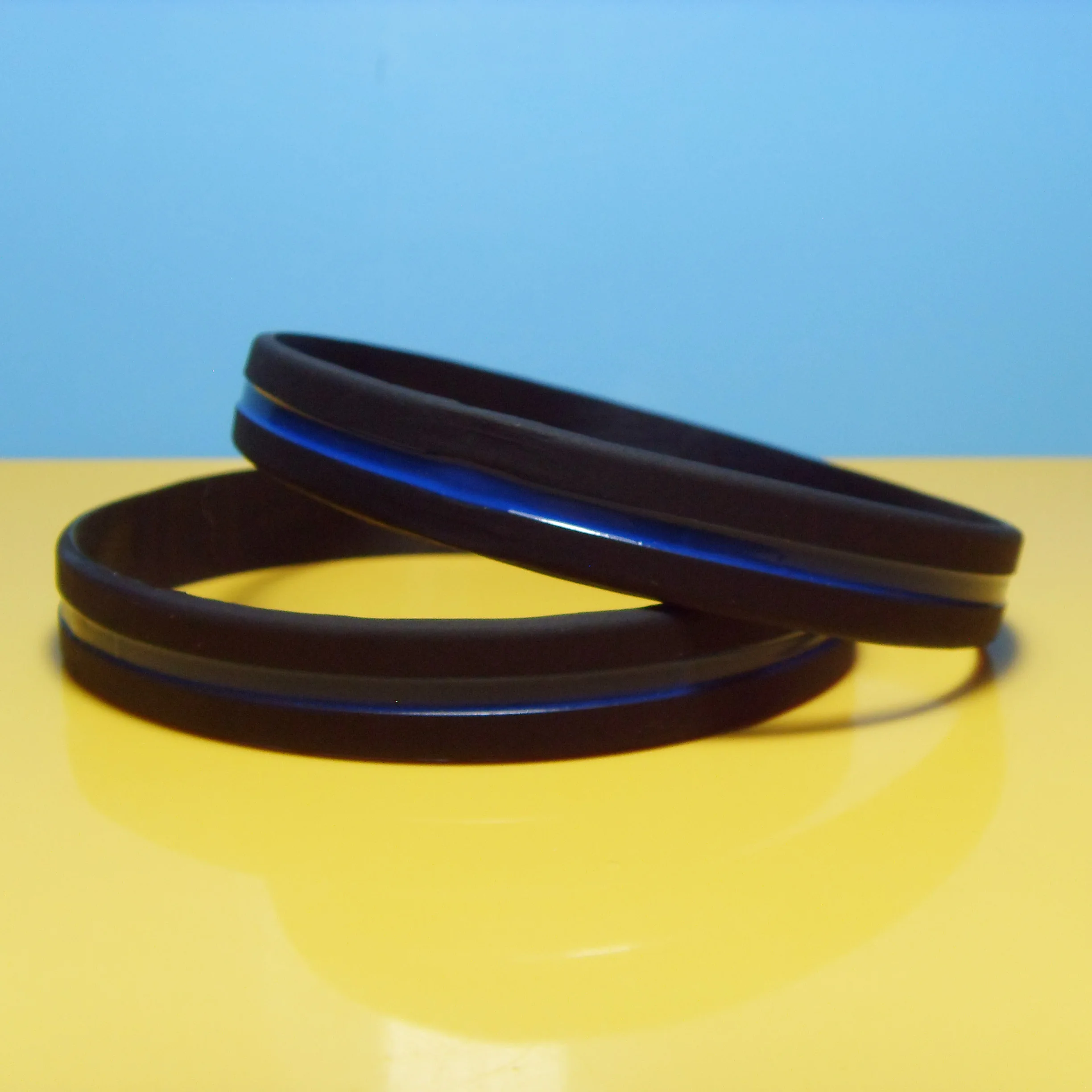 

Hot Selling 1/2 Inch Thin Blue Line Debossed Color Filled Silicone Wristbands, Any colors available