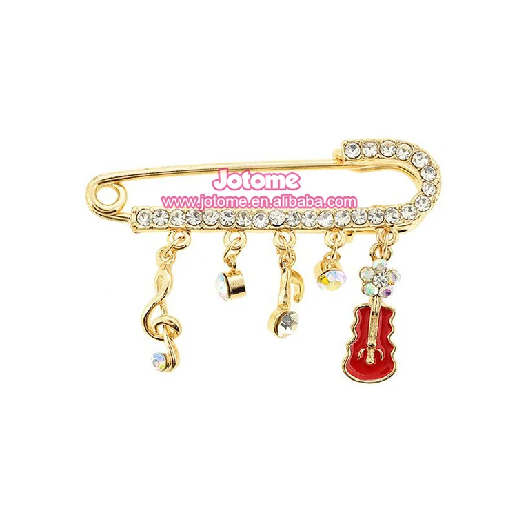 

Rhinestone and plating note & violin Gold tone Brooch