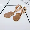 Rose gold face shape cuff and dangling earring designs for girl