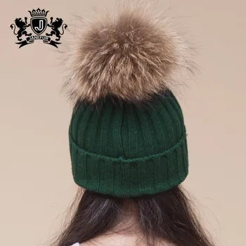 cream hat with fur pom pom