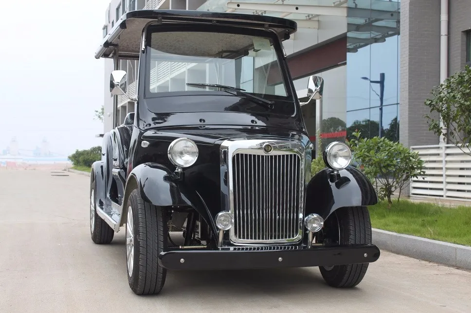 Old fashioned 6 seater electric scooter car automobile