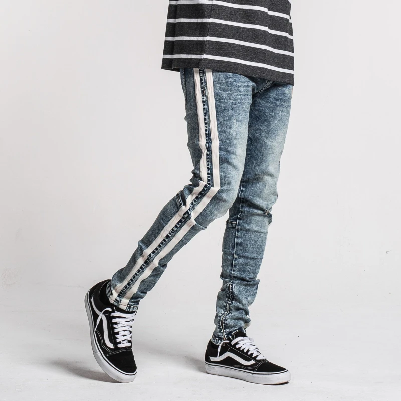 ripped jeans with white stripe