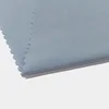 China Supplier Down Jacket Wind Coat Garment Material 50D 100% Polyester Peach Skin Fabric bruched plain woven fabric