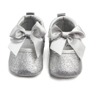 silver baby shoes