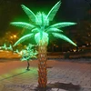 Artificial LED outdoor lighted palm trees illuminate