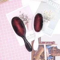 

Black round plastic paddle boar bristle hair brush with nylon