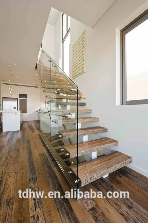 
Single spine stringer stairs with 12mm frameless glazed balustrades and Flat bar handrails 