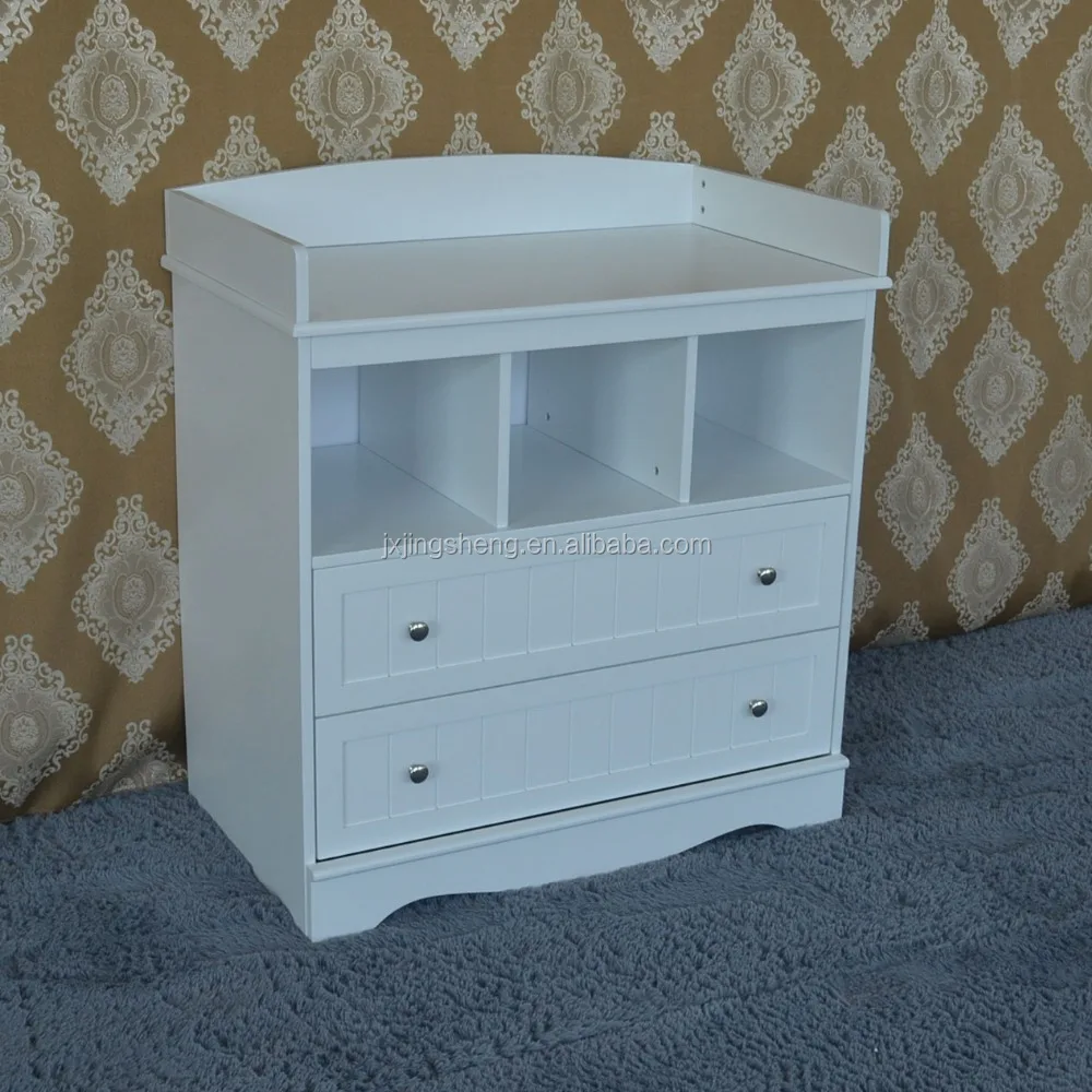 white baby changing table with drawers