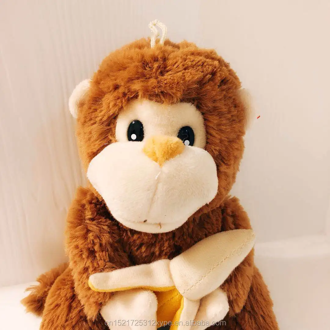 stuffed yellow and black monkey with banana