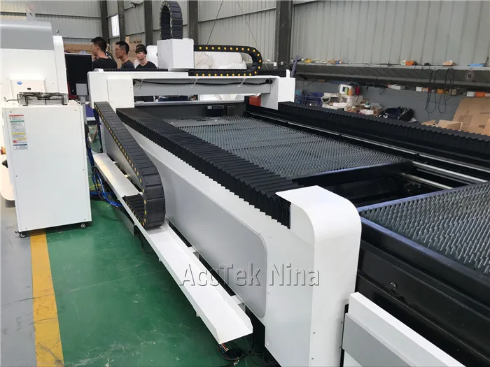 China 1000W fiber laser cutting machine cut 12mm carbon steel with exchange table