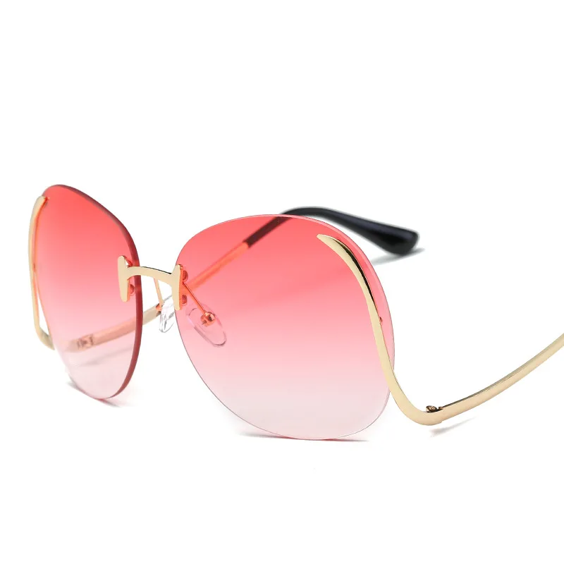 

Hot sell outdoor traveling UV400 fashion sea slice big frame women rimless metal sunglasses