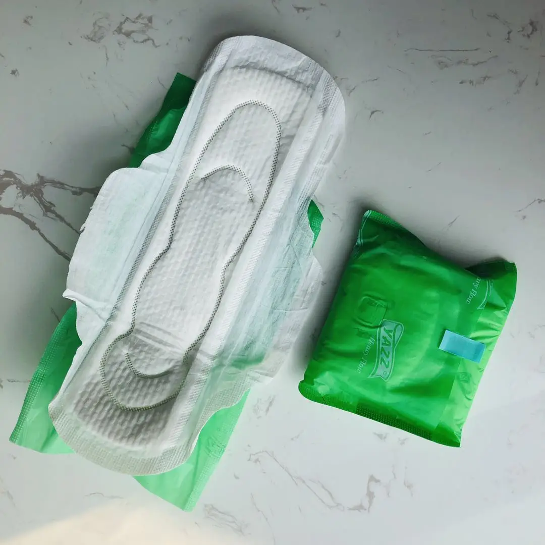 

Perforated nonwoven surface sanitary pads