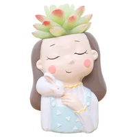 

Roogo Resin Little Warm Wreath Girl Planter pots