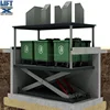Stationary hydraulic hidden scissor lift for dustbin