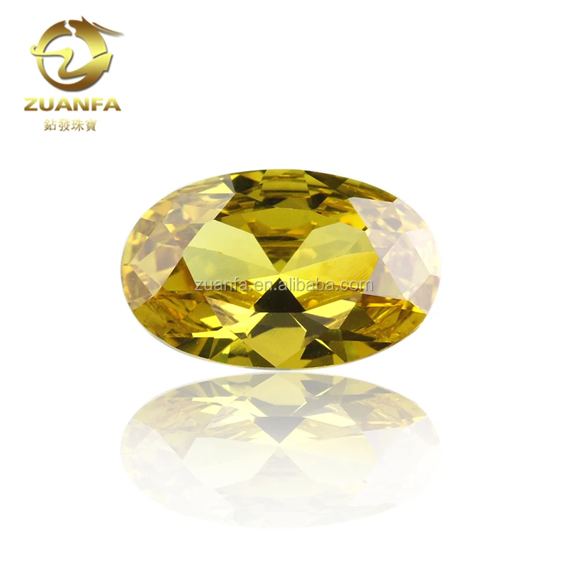 

Wholesale price high quality machine cut Oval 12*16mm Golden CZ gem