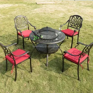 Image of Round Bronze Outdoor Patio Garden Furniture Cast Aluminum Metal Fire Pit Table Set with Cover