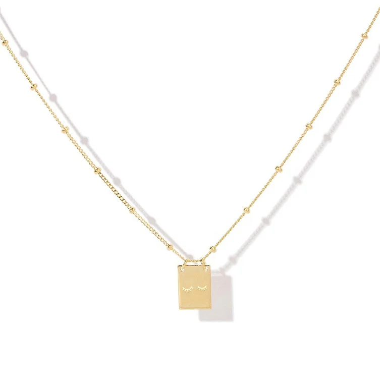 

eyebrow dreamer custom medallion coin necklace gold