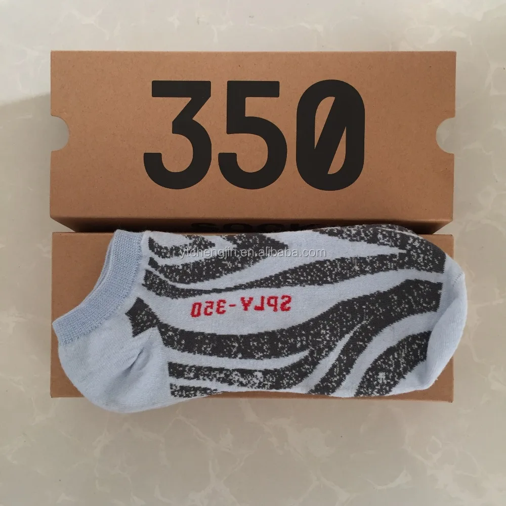 

blue tint new yeezy socks along with begula 2.0 and semi frozen yellow come in a yeezy boost 350 box, Yeezy boost 350 v2 design