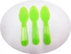 delicate green plastic small spoon for sushi