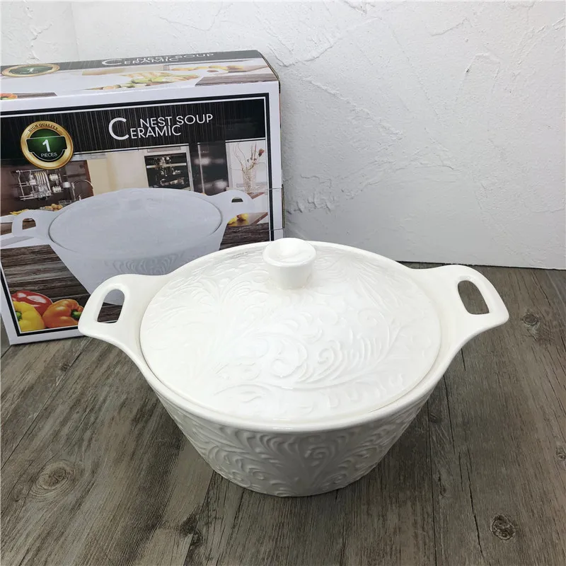 
white porcelain round ceramic soup tureen with embossed decoration and two handles 