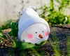 Christmas tree decorated with a transparent ball decorated with the snowman's hanging decorations in stock