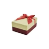 Typical lid and base paper gift box with ribbon bowknot