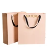 /product-detail/fancy-custom-gold-foil-logo-gift-packaging-paper-bag-with-ribbon-handle-white-paper-bags-with-handles-60724563418.html