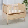 Hotselling automatic swing solid pine wood baby crib/baby cradle infant bed with wheels