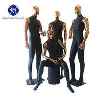 

Window display dolls gold head black body chrome male mannequin