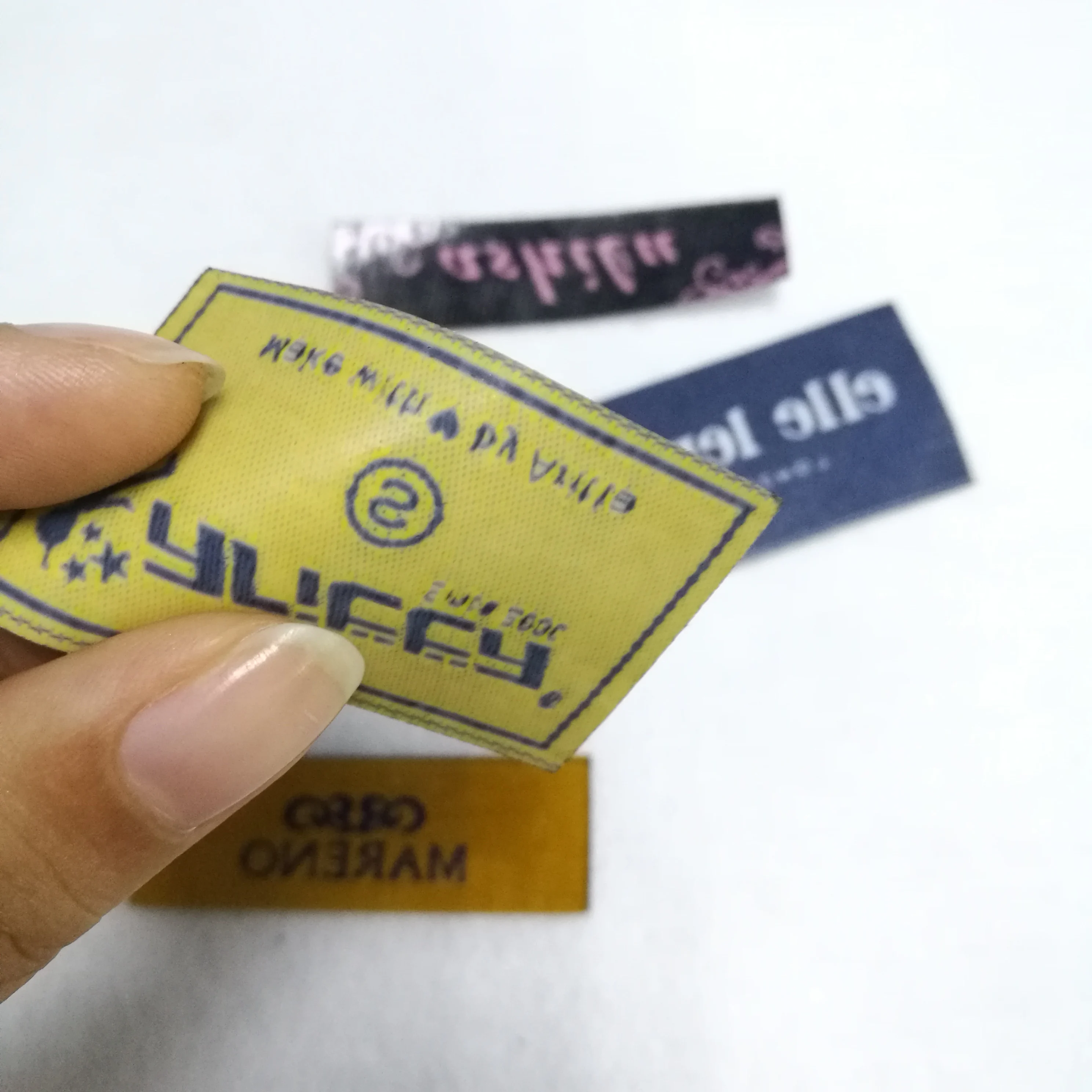 

Guangzhou factory Custom design Luxury heat cut iron on woven label clothing tags, Custom color