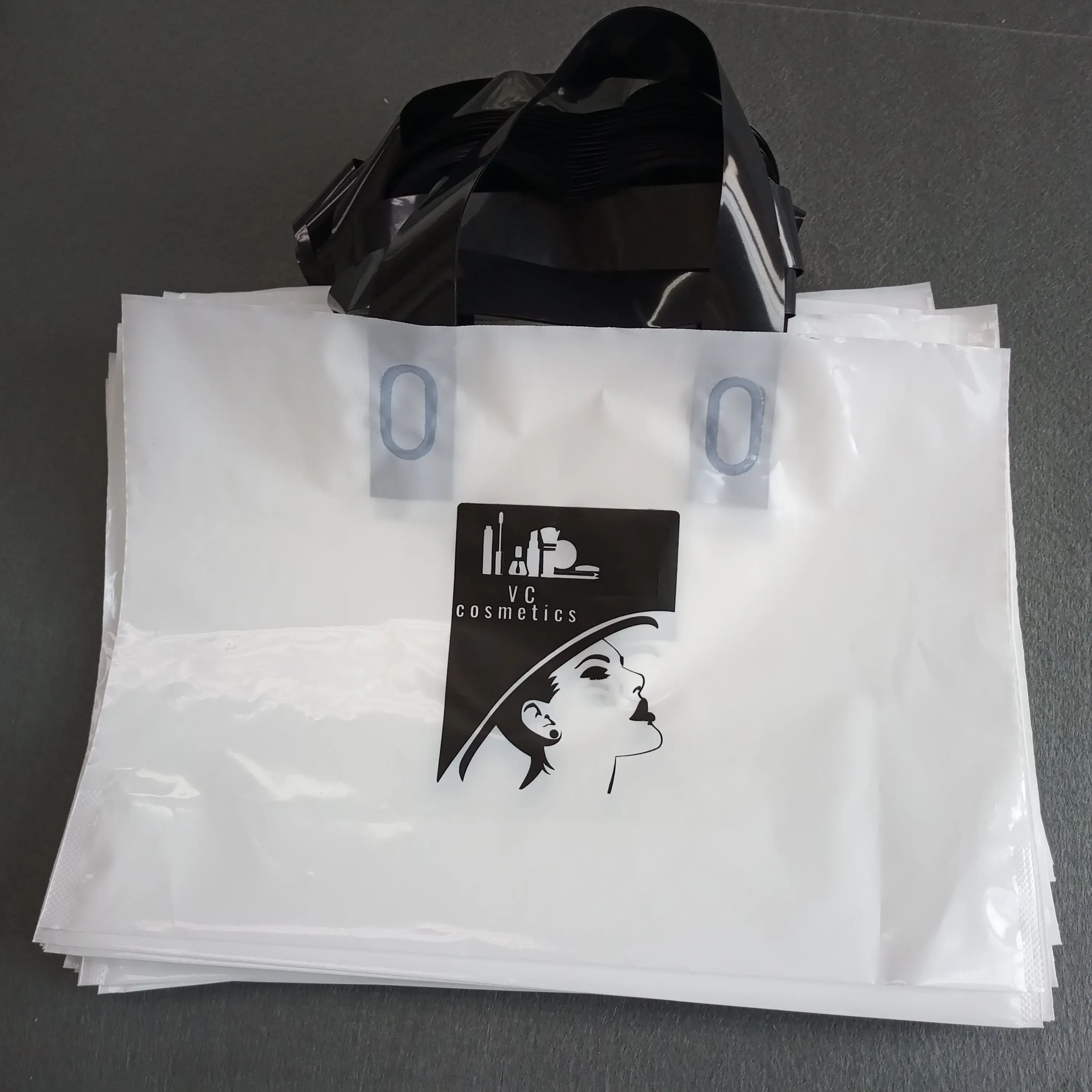 

Biodegradable retail clothing shopping package custom printed coloured plastic die cut handle bag, Cmyk