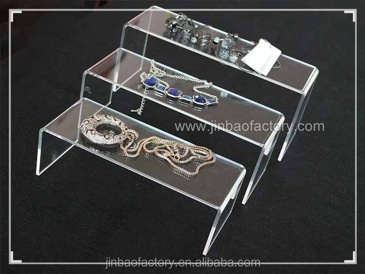 acrylic shelf risers.jpg