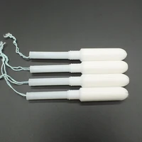 

Feminine organic cotton tampons with plastic applicator