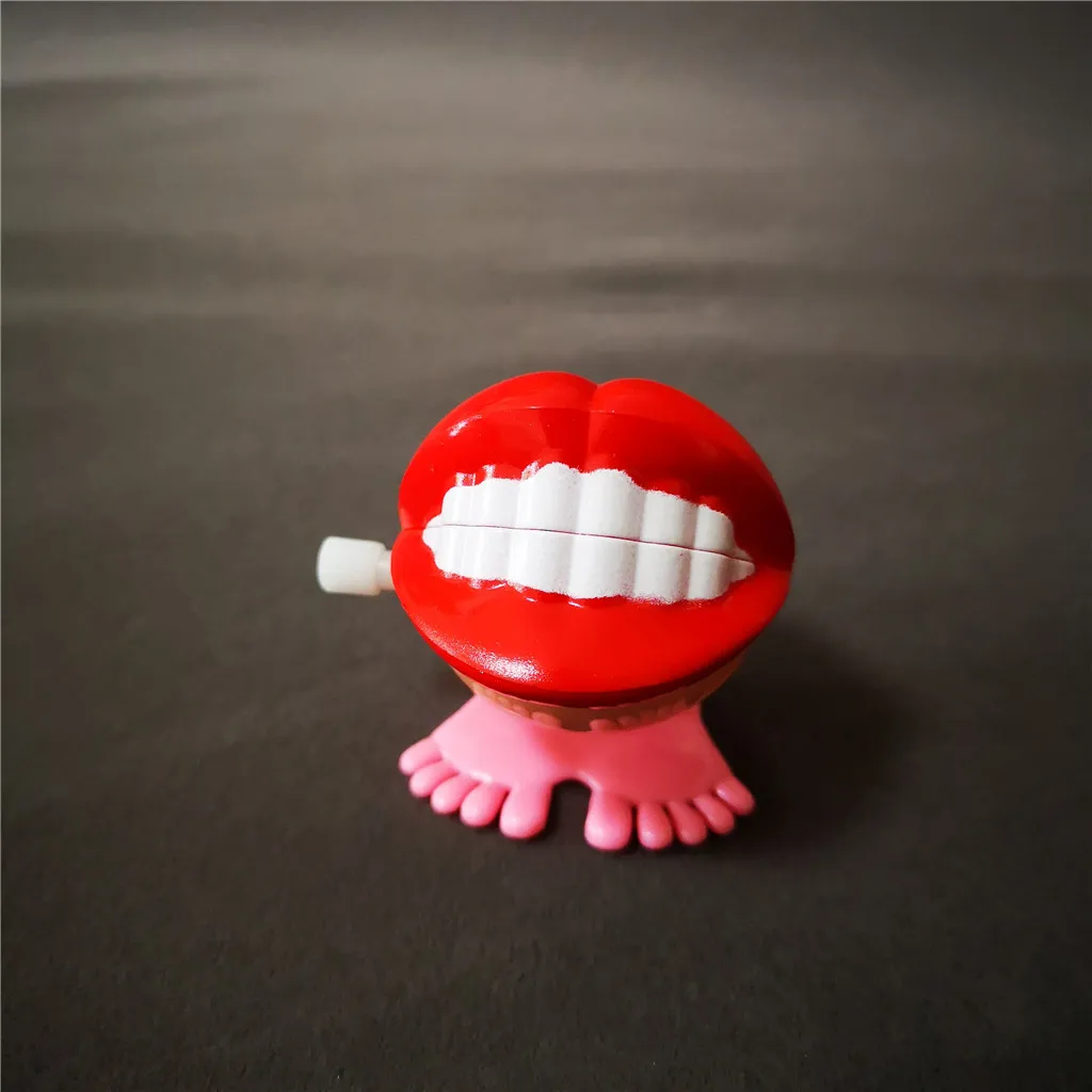 Jumping Wind up chain red lips teeth Dancing toys
