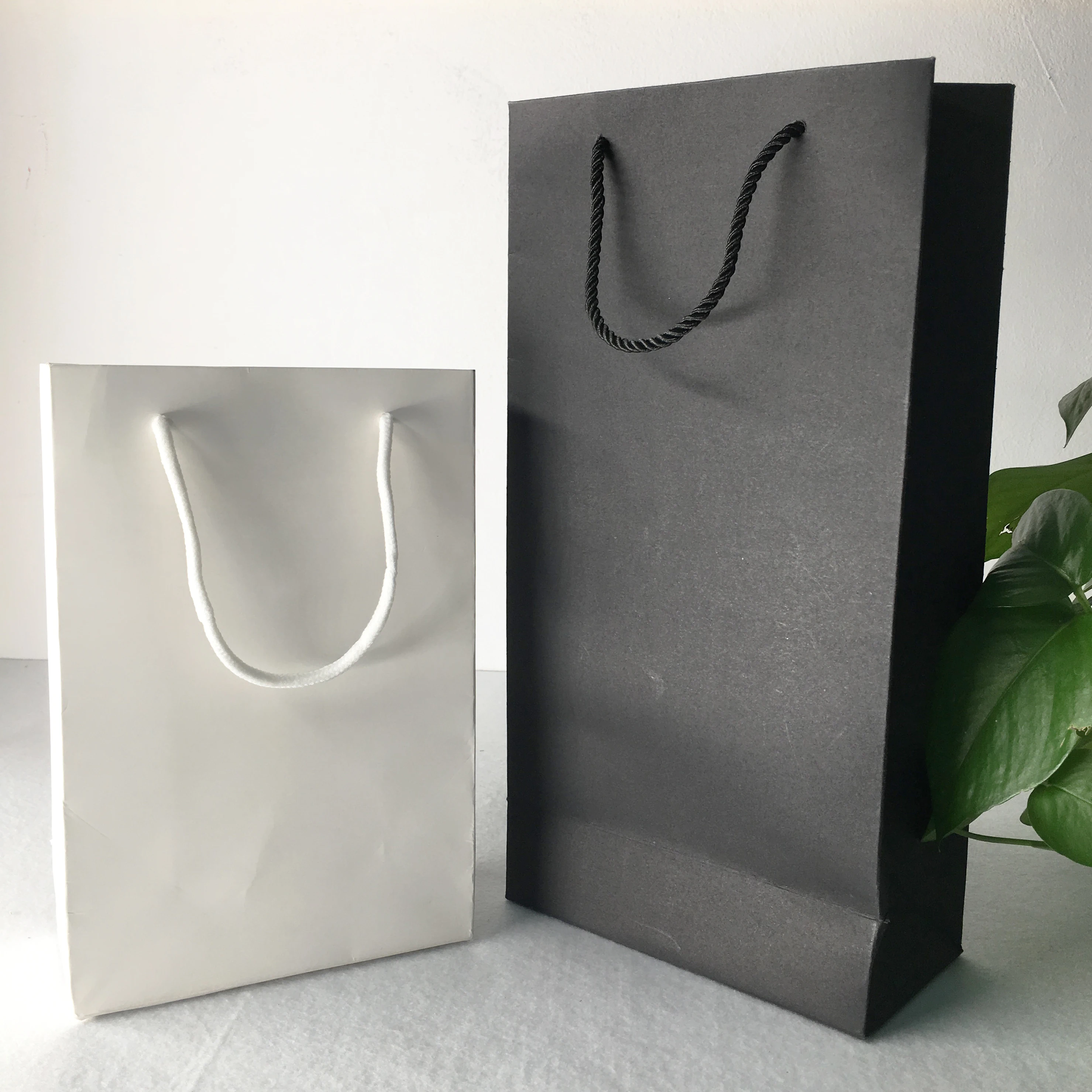 

custom vertical type black/white cardboard paper bag with cotton rope
