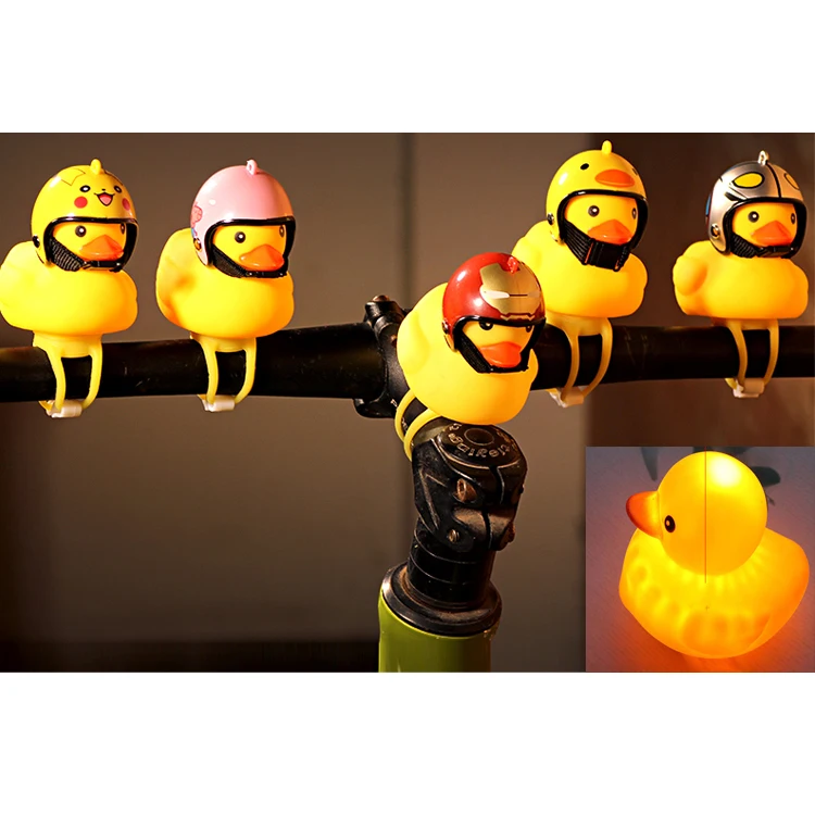 

2019 new arrivals promotional toys novelty mini portable cute yellow rubber flashlight bike bell horn light duck with helmet