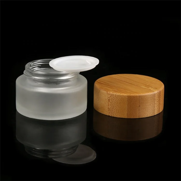 

Eco-Friendly Face Cream Container Frosted Clear Glass Cosmetic Jar 50g Spiral Mouth Bamboo Lid Frosted Glass Cream Jar