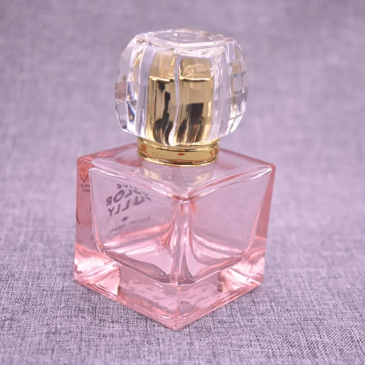 perfume in a pink square bottle