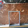 Irregular grain polished orange marble slabs