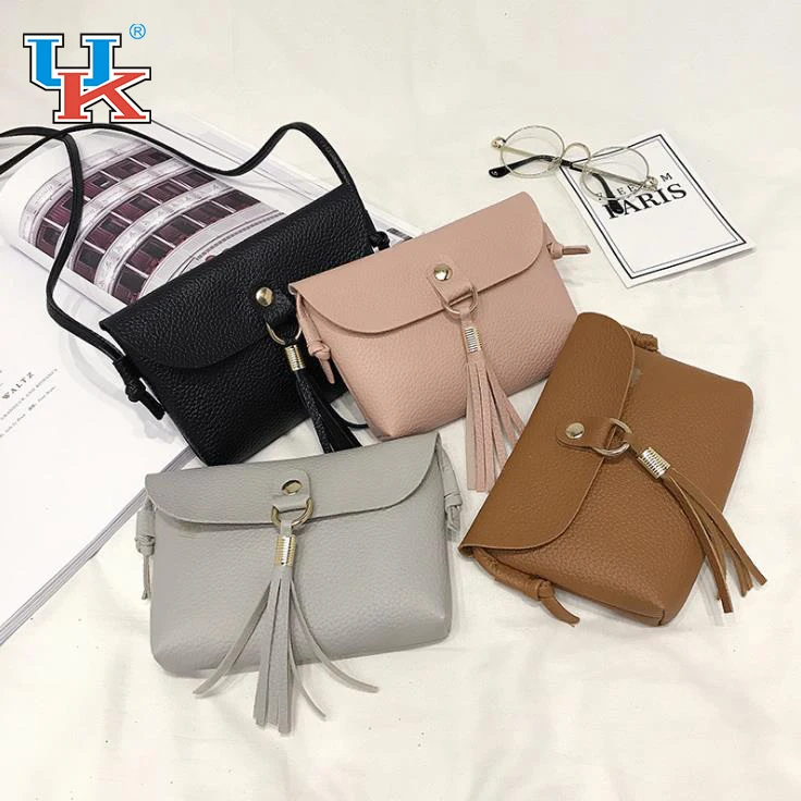 

New ladies casual magnetic buckle shoulder mobile phone purse tassel bag
