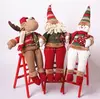 christmas decorating of climbing ladder santa claus soft toys