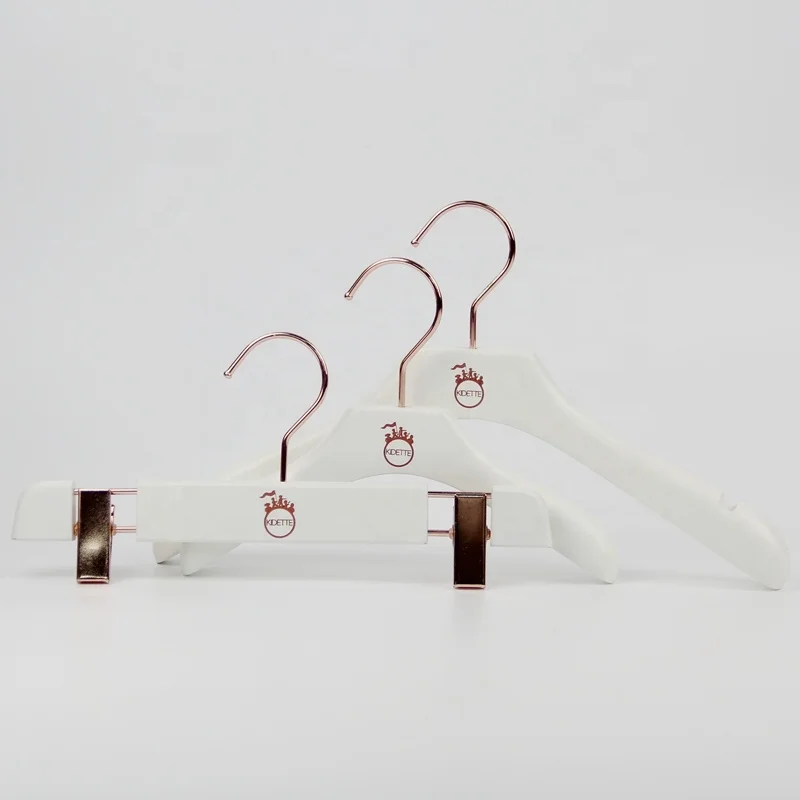 brand wood hanger with logo.jpg