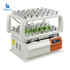 Bottle shaker for high-volume production operations and research strain screening