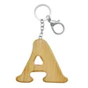 A shape initial letter wooden keychain personalised custom wood letter keytag wholesale engraved monogram bag decoration